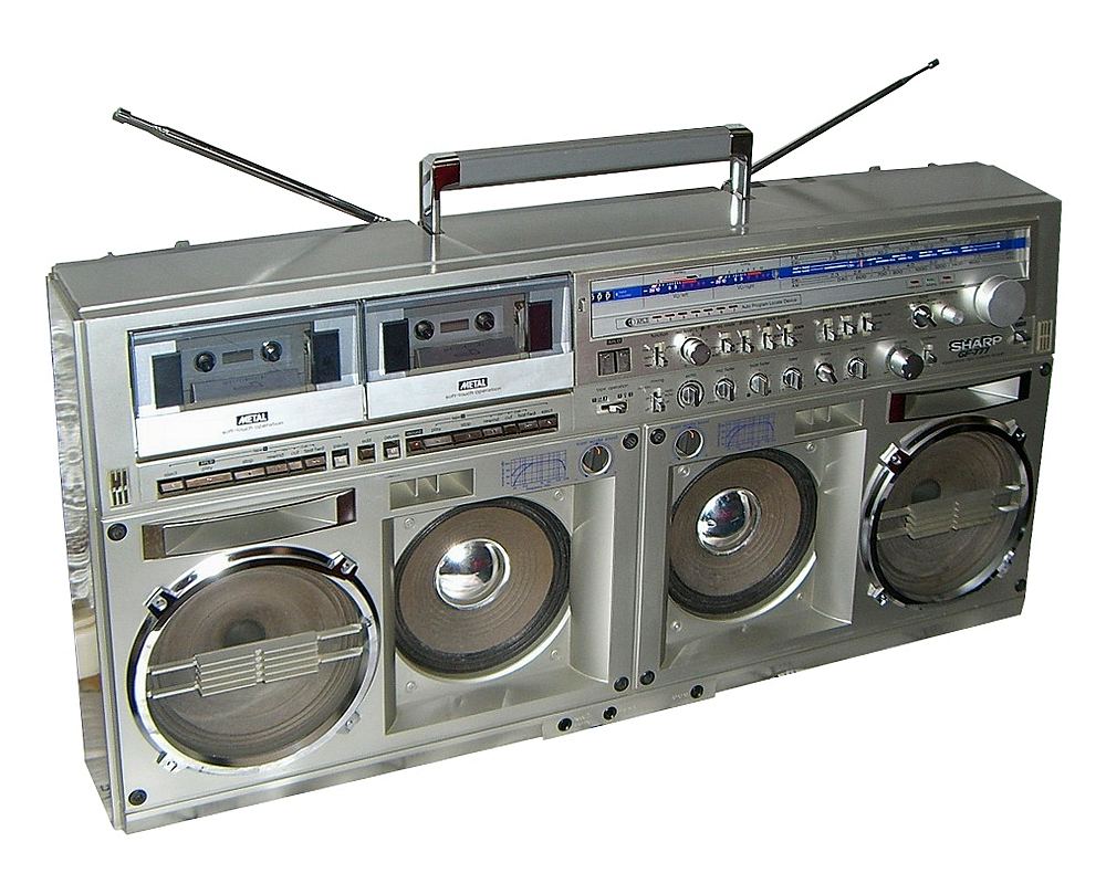 A large silver Sharp GF-777 boombox with two cassette decks, big round speakers and extended antennas