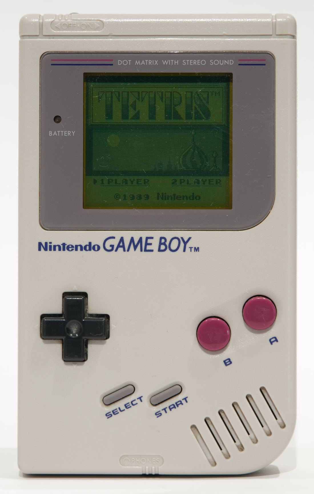 An original Game Boy switched on and showing the Tetris title screen