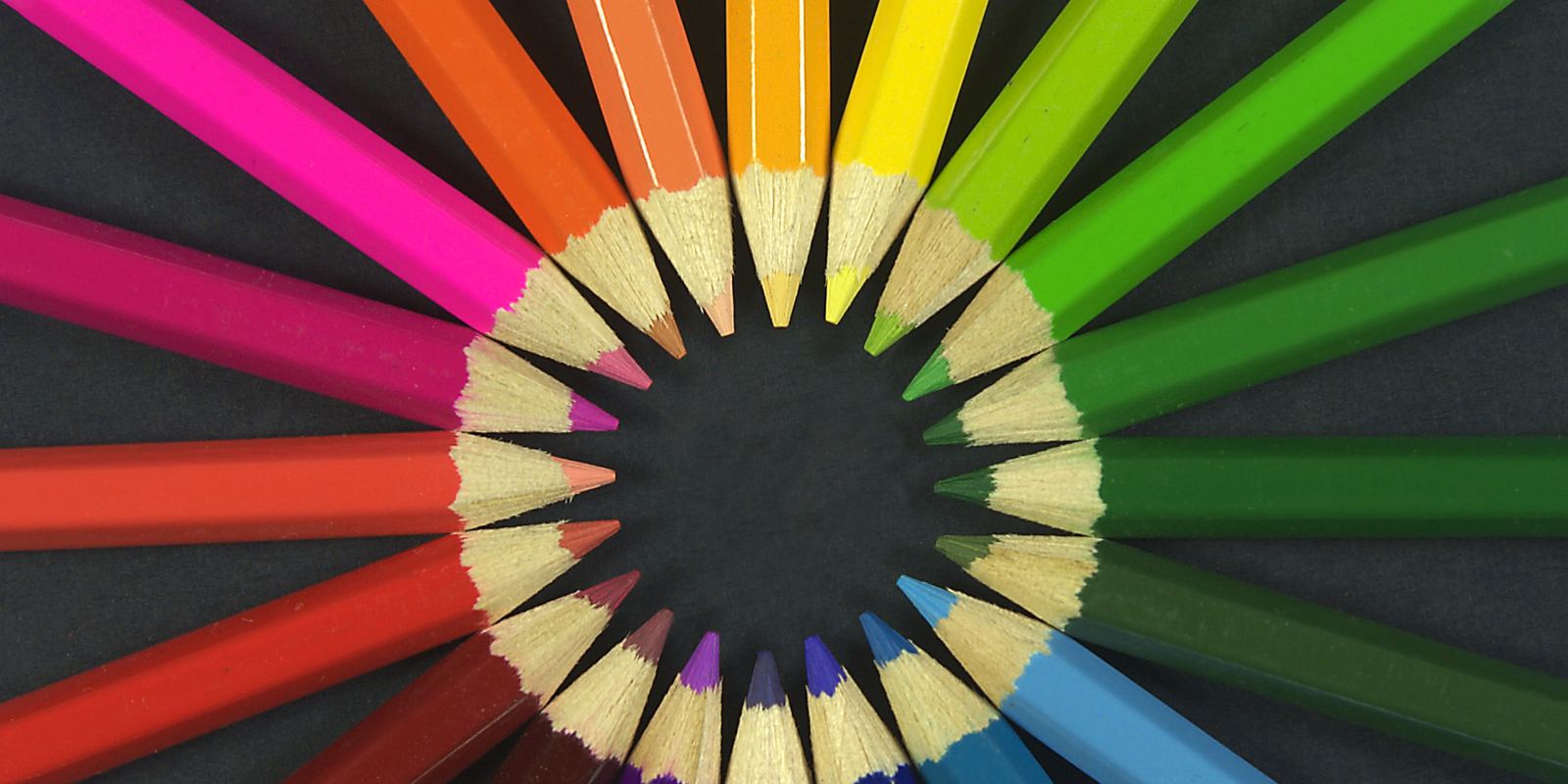 A row of sharpened coloured pencils