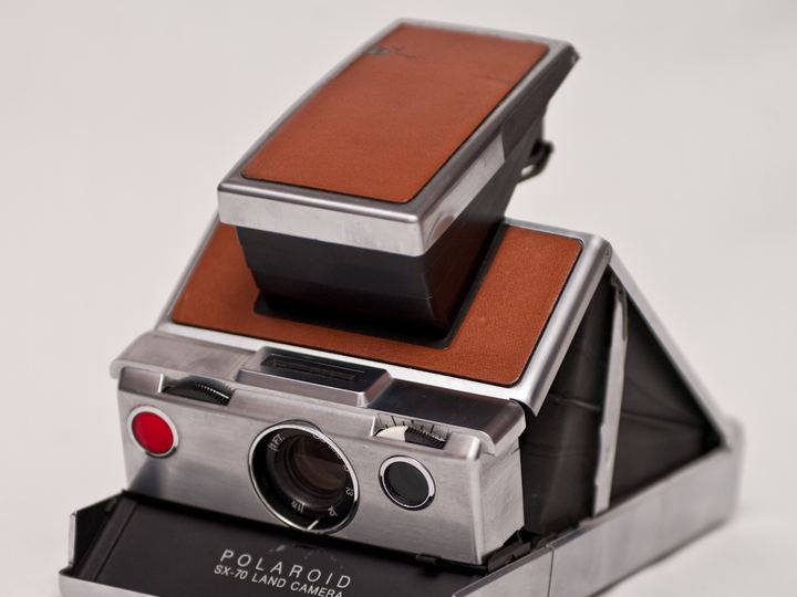 A folding Polaroid SX-70 instant camera