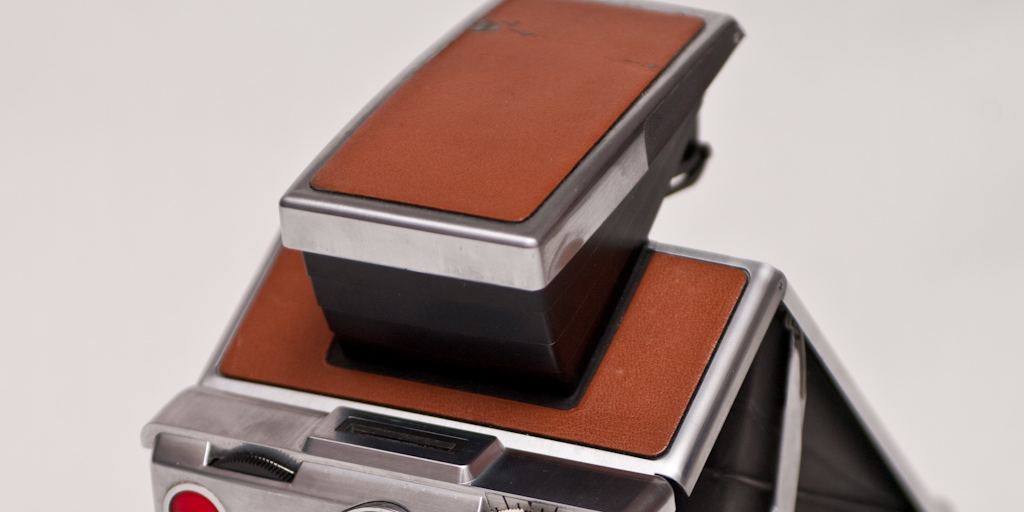 A folding Polaroid SX-70 instant camera