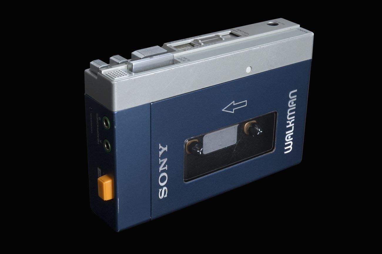 A blue and silver Sony Walkman TPS-L2 cassette player photographed on a black background