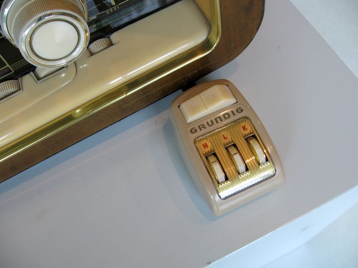 A vintage television remote control with large buttons